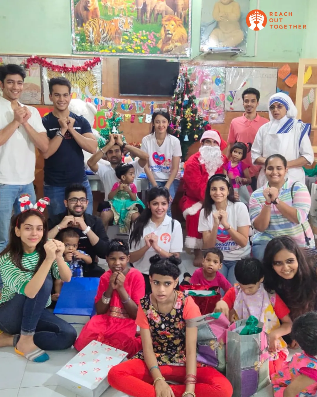 Aanchal Vash with Reach Out Together volunteers and children at a community drive in Fort York, Ward 10